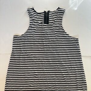 Flowy soft jersey tank top with cute zipper detail in back.